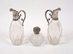 Two Austro-Hungarian silver mounted glass ewers, Vienna, 1867-1922, 800 standard, stoppers