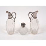 Two Austro-Hungarian silver mounted glass ewers, Vienna, 1867-1922, 800 standard, stoppers