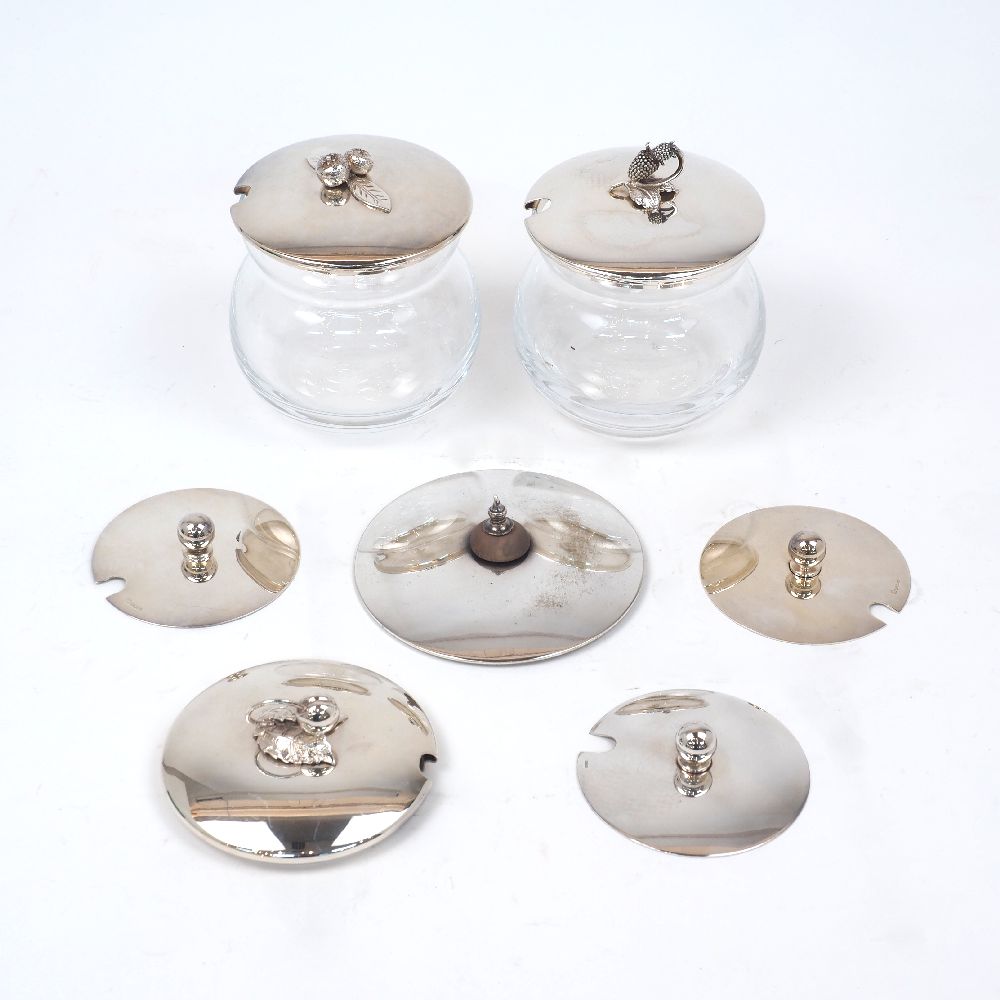 Three assorted lids with modelled fruit finials, all stamped sterling and with German hallmarks,