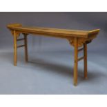 A Chinese elm altar table, 20th Century, the rectangular top with raised ends above frieze with