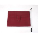 A Delvaux red calf leather single compartment briefcase, with leather clasp, in original dust bag,