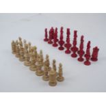 A Macao carved ivory bust type chess set, mid 19th century, one side stained red, the opposing