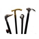 A quantity of walking sticks, 20th century and earlier, of varying materials, shapes and sizes, to