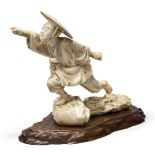 A Japanese ivory figure of a man, Meiji Period(late 19th-early 20th century), modelled striding