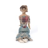 A wax over composition slit-head doll, some wax missing, on a cloth body with leather lower arms,