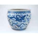 A Chinese blue and white porcelain 'dragon' jardinière, second half 20th century, painted with