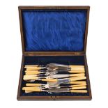 A part set of silver fruit eaters, Sheffield, c.1915, Walker & Hall, comprising three knives and