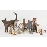 A group of studio pottery cats, to include; a pottery Cheshire cat by Eleanor Madonik (1929-2006),