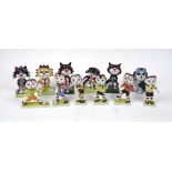 A quantity of Lorna Bailey pottery cats, 20th century and later, modelled with football theme, with