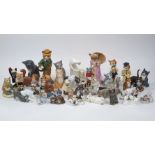 A collection of pottery cats to include; a black basalt salt glazed Wedgewood cat, modelled by