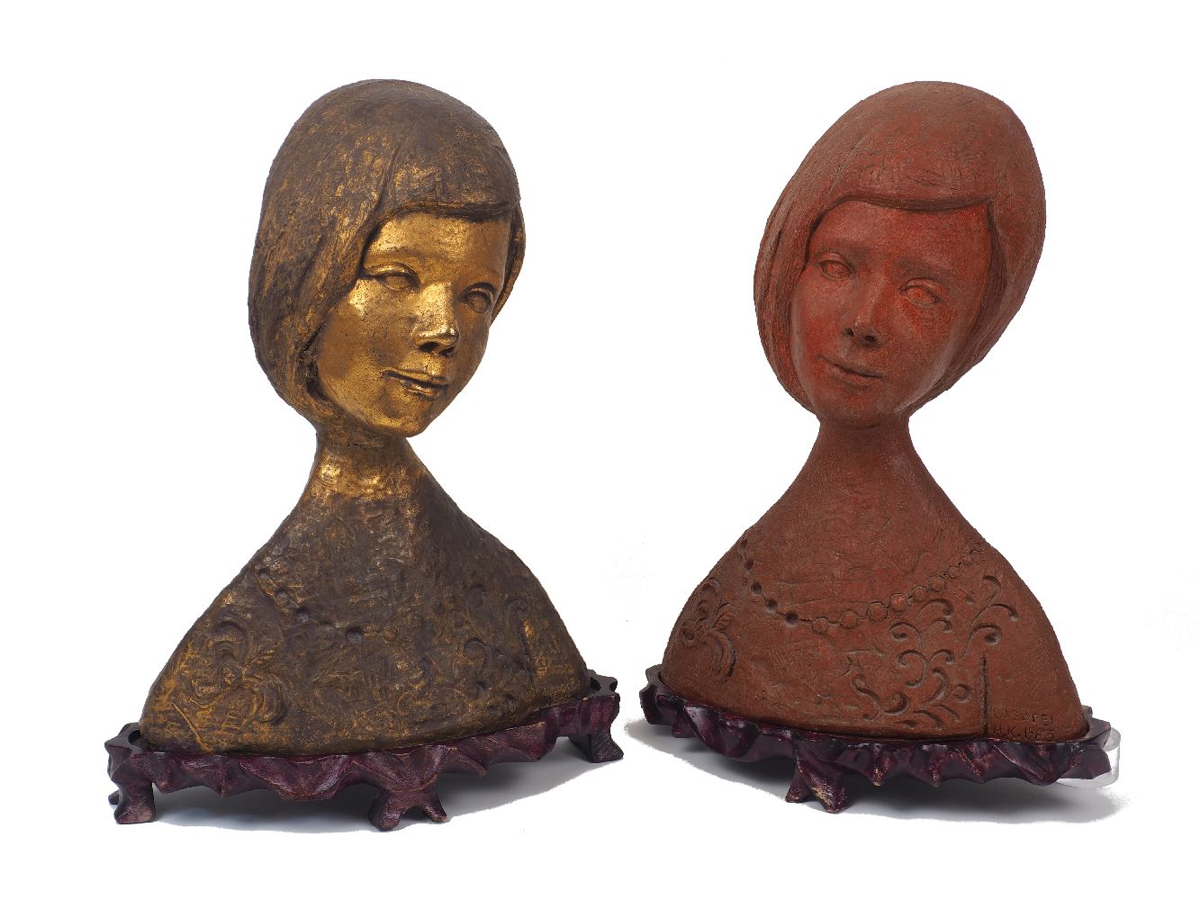 Two female pottery busts, 20th century, of the same model, terracotta, adorned with necklace and