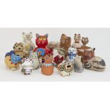 A collection of pottery cats, of stylised rotund form, of varying makers, designs and sizes, tallest