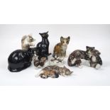 A collection of Winstanley pottery cats, to include an ashtray modelled as a cat sitting by a