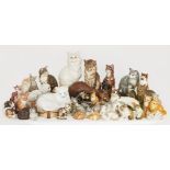 A large collection of pottery cats, to include a Wedgwood ginger cat, hand-painted with factory