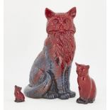 A Royal Doulton flambé figure of a cat, with printed factory mark to base and indistinct impressed