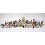 A large collection of miniature pottery and plastic cats of various designs and makers, together