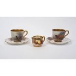 Two Royal Worcester miniature porcelain teacups and saucers, one hand-painted with highland