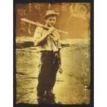 Four sepia-toned reproduction prints of vintage photographs depicting big game hunters, 28 x 20.