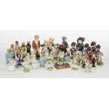 A collection of porcelain character cats, to include examples from Royal Albert, Wade, Royal