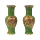 A pair of Carlton Ware baluster vases, mid to late 20th Century, of green ground decorated with '