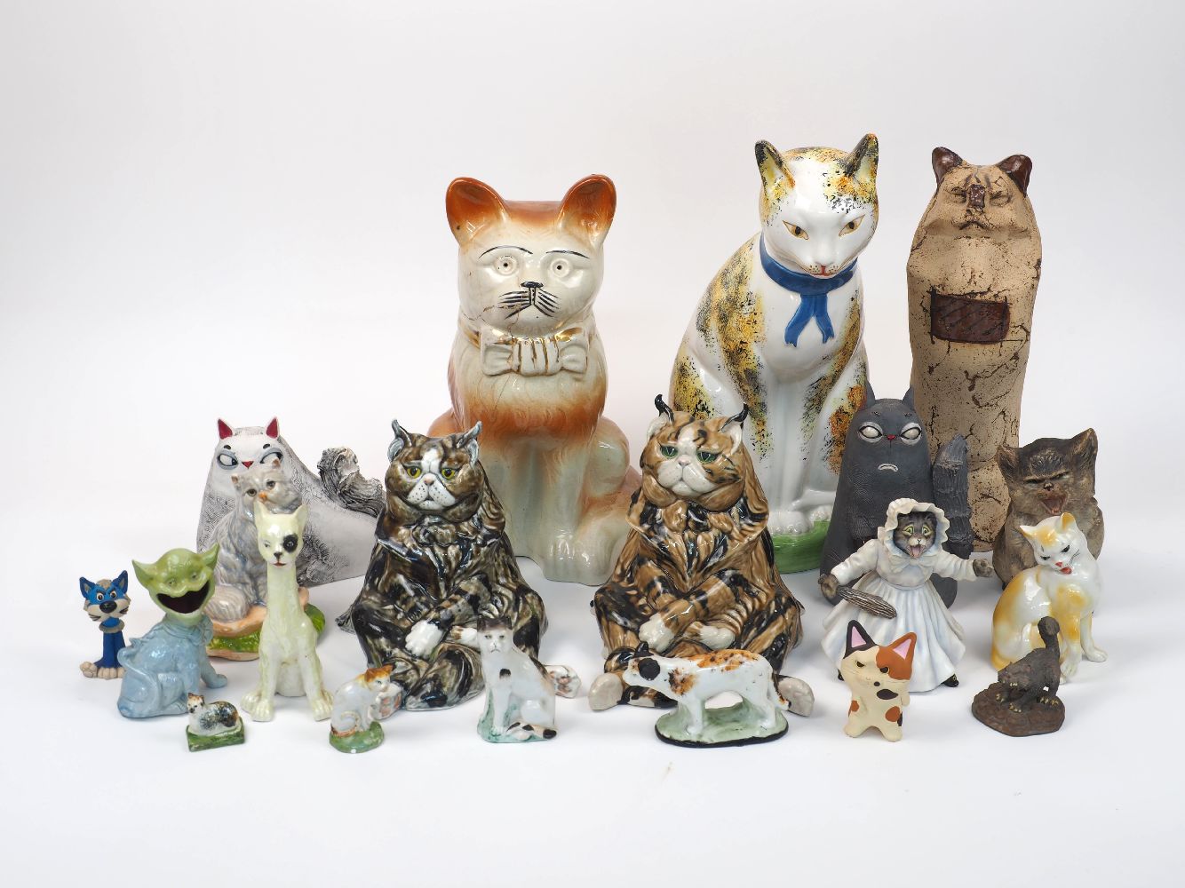 A group of ceramic expressive cats, both factory made and hand-built, to include Avalon, Buxton,