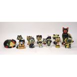 A quantity of Lorna Bailey pottery cats, 20th century and later, to include; a money bank moulded