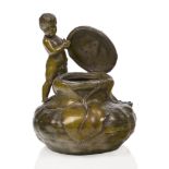 J. Garnier (French 1853-1910), a metal figural vase patinated to simulate bronze, c.1890, signed