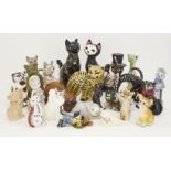 A collection of assorted decorative cats, to include; pottery, wood, plaster and plastic examples,