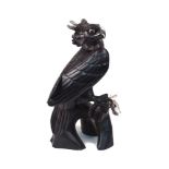 A Reprosa Treasures of Panama carving of a Harpy Eagle made from Cocobolo hardwood with a sterling