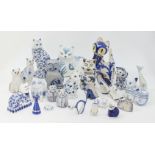 A collection of pottery cats, of blue and white colour way, to include; a David Sharp Rye Pottery