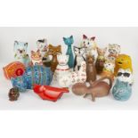 A collection of pottery cats modelled as money banks of factory manufacture and studio pottery