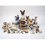 A quantity of pottery Siamese cats, to include; a large seated Beswick cat, stamped Beswick