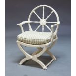 A white painted wheel-back armchair, early 20th century, on x-framed basePlease refer to