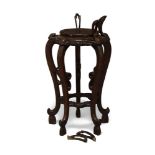A Chinese hardwood carved jardiniere stand, probably 19th century, carved throughout, turned