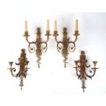 A set of four gilt-bronze twin-light wall appliques, late 20th century, the backplates modelled as