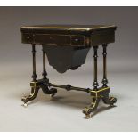 A Victorian ebonised folding work table, circa 1880, the rounded rectangular top above central