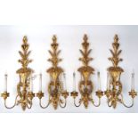 A set of eight giltwood twin-light wall appliques, second half 20th century, the backplates carved