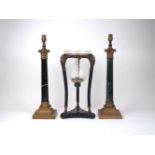 Two modern gilt metal mounted marble column table lamps, one with a black marble shaft, the other