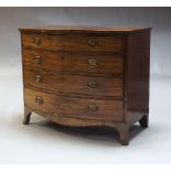 A Regency mahogany bow fronted chest of two short above three long drawers raised on splayed feet,