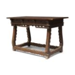 A Spanish walnut side table, late 17th century, fitted with three short drawers with moulded fronts,