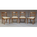 Four bar back dining chairs and a George III style mahogany twin pedestal dining table, early 20th