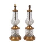 A pair of table lamps, late 20th century, of baluster form, polished and press-moulded, gilt