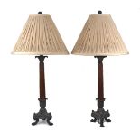 A pair of bronze and wood table lamps, late 20th century, the reeded tapering shafts on triform