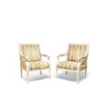 A pair of French white painted open armchairs, of recent manufacture, moulded crest rails and