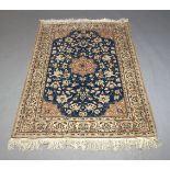 A modern Tabriz woollen rug with ivory borders to blue field, 157cm long, 107cm widePlease refer