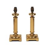 A pair of modern brass lamps, each with hexagonal shaft and square base, 31cm high (2)Please refer