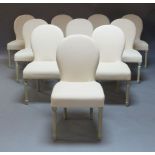 A set of ten contemporary French white painted dining chairs with cream upholstered padded back