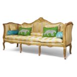 A French giltwood and gesso edged three seater sofa, 19th century, the carved frame with gesso