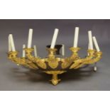 WITHDRAWN A gilt-bronze Restauration style ten-light chandelier, 20th century, the circlet with pier