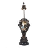 A Neo-Classical urn shaped lamp, late 19th century, the ceramic painted body decorated with leaf and